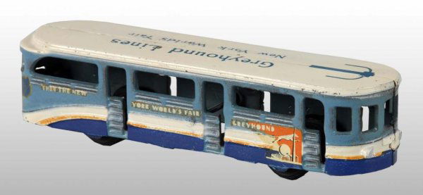 Cast Iron Arcade Greyhound NY World's Fair Toy.: Description American. Marked "Through the New York World's Fair Greyhound" on both sides of bus and nice Arcade sticker on rear. Black rubber tires and minimal wear. Condition (Excellent). Size 8" L.