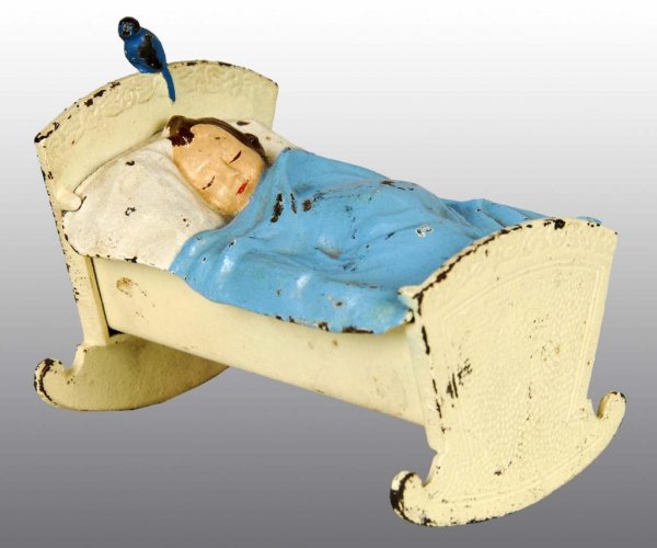 Cast Iron Baby in Cradle Still Bank.: Description Made of pot metal. Condition (Excellent). Size 4" L.