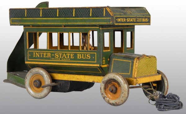 Tin Strauss Inter State Bus Wind-Up Toy.: Description American. Working sporadically. Separate, original driver. Rare stairs are original but need to be tabbed back in. Some rust on wheels and dirt and wear throughout. May clean to a better g