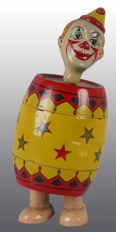 Tin Chein Clown in Barrel Wind-Up Toy.: Description American. Working. Beautiful, colorful lithography. Marked "Chein" on rear. Some minor scratching and wear with one small spot of litho loss on front. Condition (Very Good). Size 7" T.