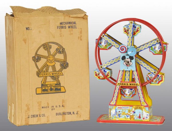 Tin Chein Walt Disney Ferris Wheel Wind-Up Toy.: Description American. Working but wheel does not spin around because it's missing its fastener. Nice, bright lithography depicting Mickey and Minnie in carts. Moderate wear overall. Includes complete 