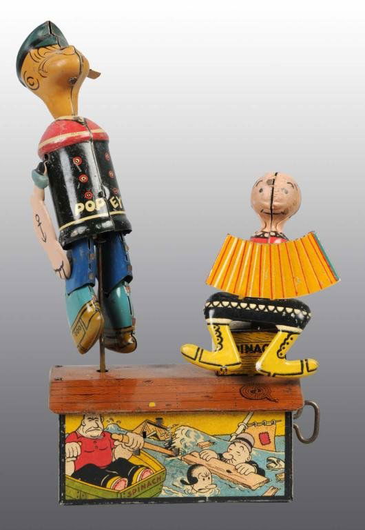 Tin Marx Popeye & Olive Oyl Wind-Up Roof Dancers.: Description Working. Some moderate overall wear and toy is missing on/off lever. Condition (Very Good - Excellent). Size 9" T.