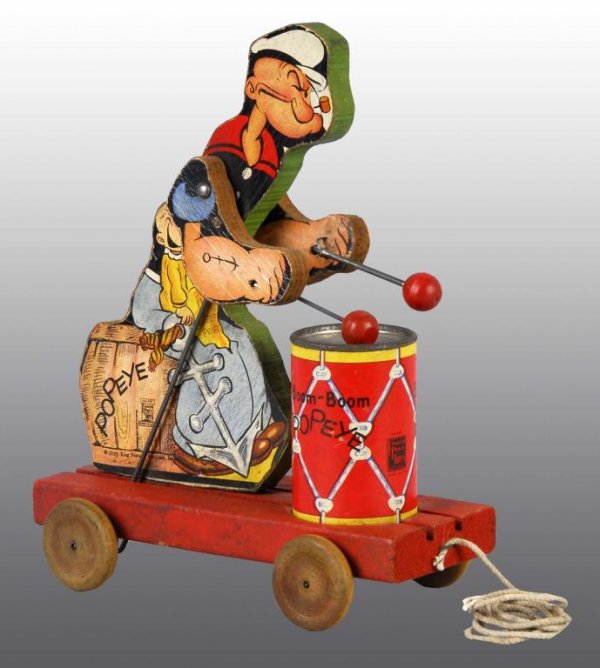 Fisher Price No. 491 Popeye Boom-Boom Toy.: Description American. Circa 1937. Original mallets and drumhead. Condition (Very Good). Size 9 - 1/2" T.