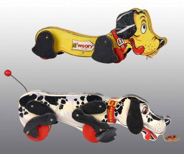 Lot of 2: Fisher Price Dog Pull Toys.: Description American. Includes no. 700 Wolfy and no. 180 Snoopy Sniffer. Snoopy has original ears and feet. Condition (Very Good). Size Both: 16" L.