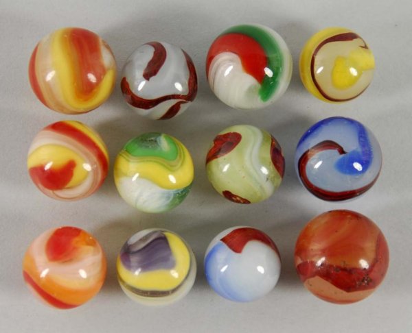 Lot of 12: Akro Agate Marbles.: Description Includes six popeye and six oxblood. Condition (8.5).