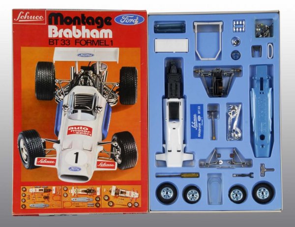 Lot of 2: Schuco Formula Race Car Toys.: Description German. Includes one plastic Marlboro wind-up car and one plastic Montage Brabham wind-up car that has never been put together. Includes two original boxes with some creasing throughout. C