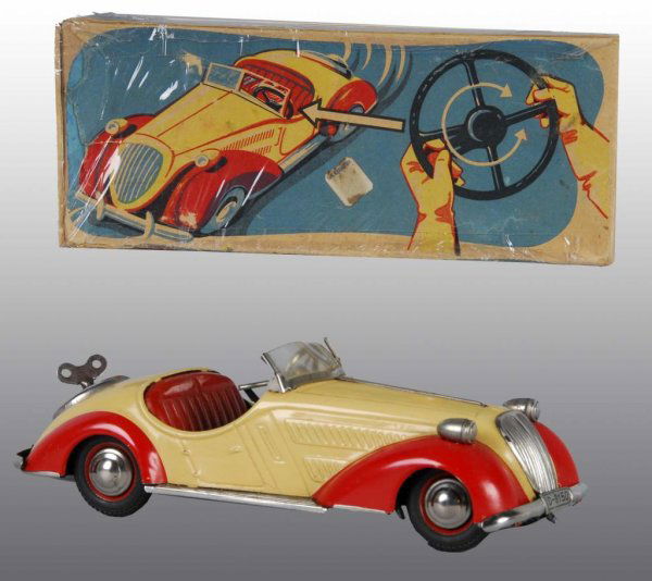 Tin Distler Convertible Car Wind-Up Toy.: Description German. Working. Car has some minor scratching and wear. Includes complete, colorful original box marked "Made in US Zone Germany". Condition (Toy - Near Mint, Box - Excellent). Size 9" L.