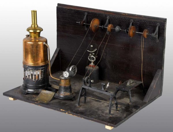 Buckman Vertical Steam Engine with Work Shop.: Description This is a very rare example of an early Buckman vertical steam engine that was sold with four original Buckman accessories and a line shaft or transmission, all mounted in an original wood