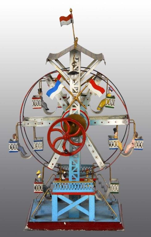 Tin Hand-Painted Steam-Driven Ferris Wheel Toy.: Description German. Made by the Doll Company. Includes seven original figures, original flag, and original lights. Some paint flaking on roof. Condition (Very Good - Excellent). Size 13" T.
