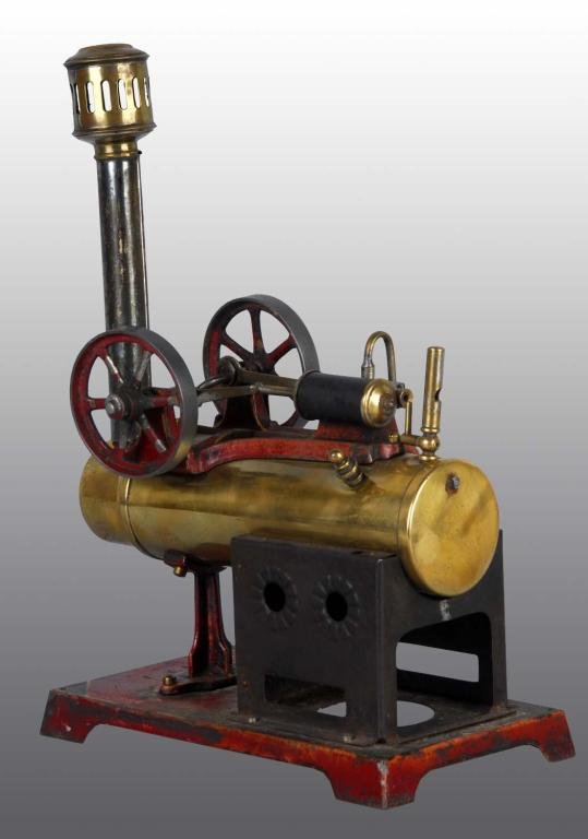 Doll et Cie No. 511/1 Overtype Engine.: Description This two has two flywheels, a whistle, and a safety valve. The burner is missing. Condition (Very Good). Size Engine: 6 - 1/2" L.