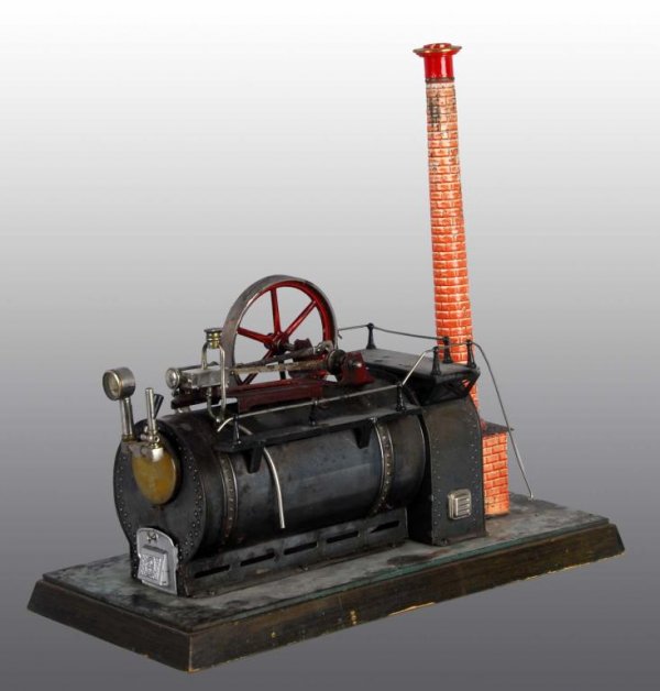 Bing No. 130/273 Stationary Steam Engine Toy.: Description Stationary overtype steam engine. This engine was made circa 1912 to 1914. Double acting cylinder, wood base plate with lithographed flagstone pattern, pressure gauge, whistle and imitatio