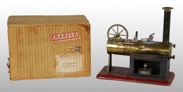 Weeden No. 312 Overtype Steam Engine Toy.: Description Includes original Montgomery Ward cardboard box. This toy has seen some use with a dent in the boiler and the wood handle on the whistle is missing. The safety value is missing its weight 