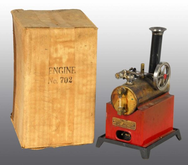 Weeden No. 702 Overtype Electric Fired Engine Toy: Description In original cardboard box. This steam engine is all complete except for the weight on the safety arm. Condition (Very Good). Size 9" x 6".