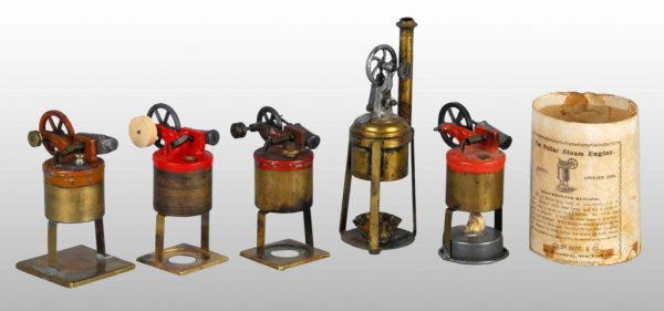 Lot of 5: Buckman Steam Engine Toys.: Description The second from the left is a copy made by Russell Snyder. The "Dollar Engine" on the right comes with its original round box. Condition (Good). Size 6" x 2". Base: 2".