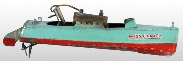 Tin "Miss Canada" Live Steam Boat Toy.: Description Japanese. Pre-war. Stenciled "Miss Canada" on both sides of front. Paint loss and wear to bottom of boat and burn marks on left side. Condition (Good - Very Good). Size 14" L.
