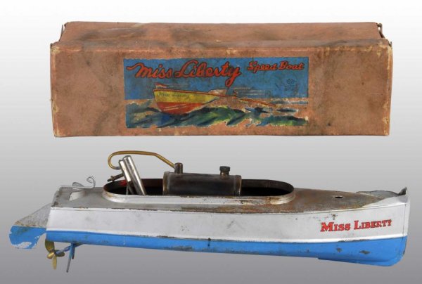 Tin "Miss Liberty" Live Steam Speed Boat Toy.: Description Japanese. Pre-war. "Miss Liberty" stenciled on both sides of front. Moderate overall wear with some oxidation and paint loss to hull. Includes original bx. Condition (Good - Very Good). Si