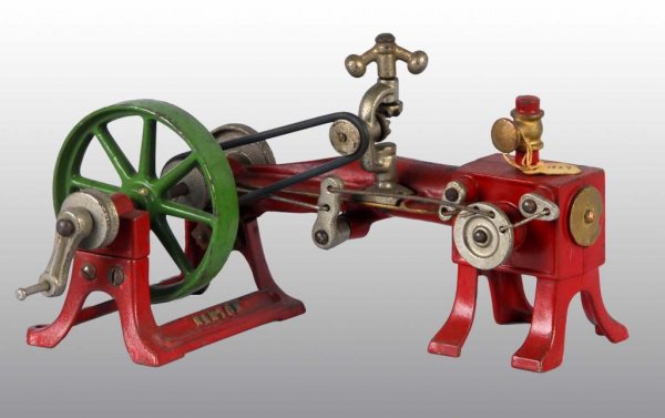Kenton Cast Iron Corliss Horizontal Steam Engine.: Description This toy has an original 1929 factory tag attached and is reported to have been a sample and display piece at the factory. The toy is in un-played-with condition. Turn the crank and the fl
