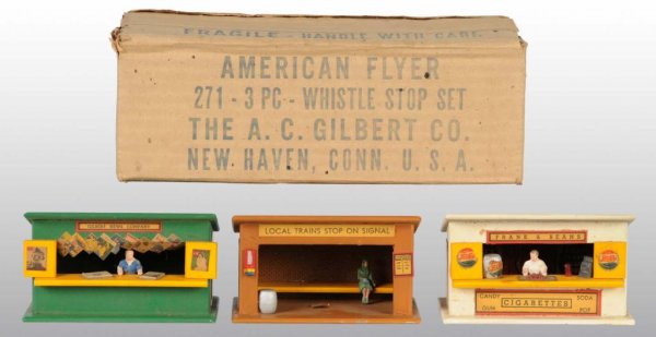 American Flyer 3-Piece No. 271 Whistle Stop Set.: Description Post-war. S-gauge. Set includes franks and beans stand, newsstand, and train waiting station. Includes original and crisp box with original insert in which the buildings sit inside. Buildi