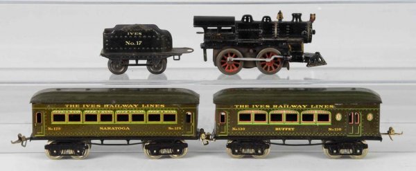 Ives O-Gauge Passenger Set.: Description American. Pre-war. Includes no. 17 cast iron clockwork locomotive, no. 17 tender, no. 129 Saratoga passenger car, and no. 130 buffet combine car. Set shows very nice patina and color with 
