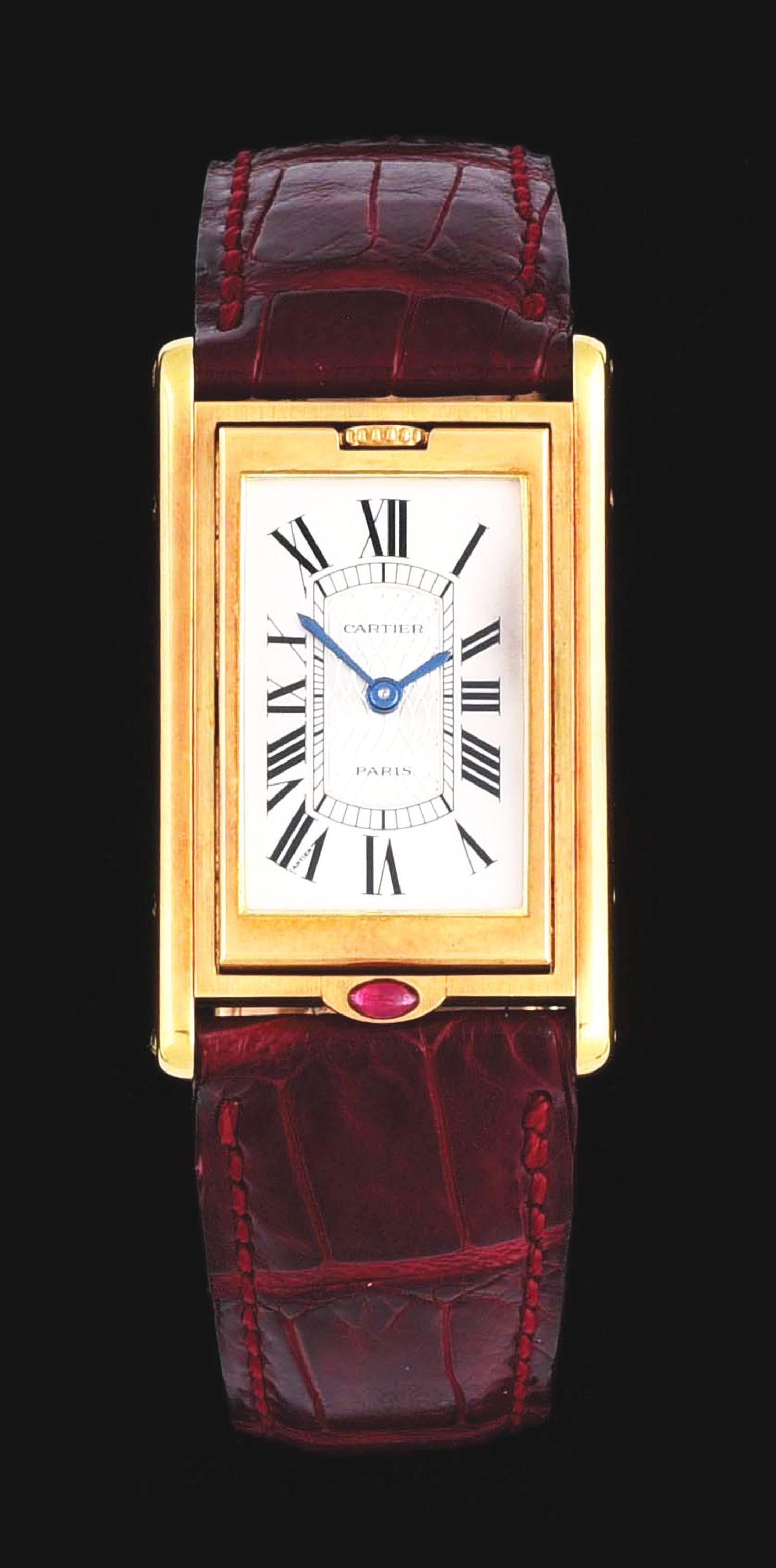 RARE 18K GOLD & RUBY CARTIER TANK BASCULANTE LT/ED: Gents rare and exceptional 18k gold and ruby Cartier Tank Basculante limited edition wristwatch for Cartier's 150th anniversary, Circa 1997. One of only 150 pieces made in this edition, this watch is 