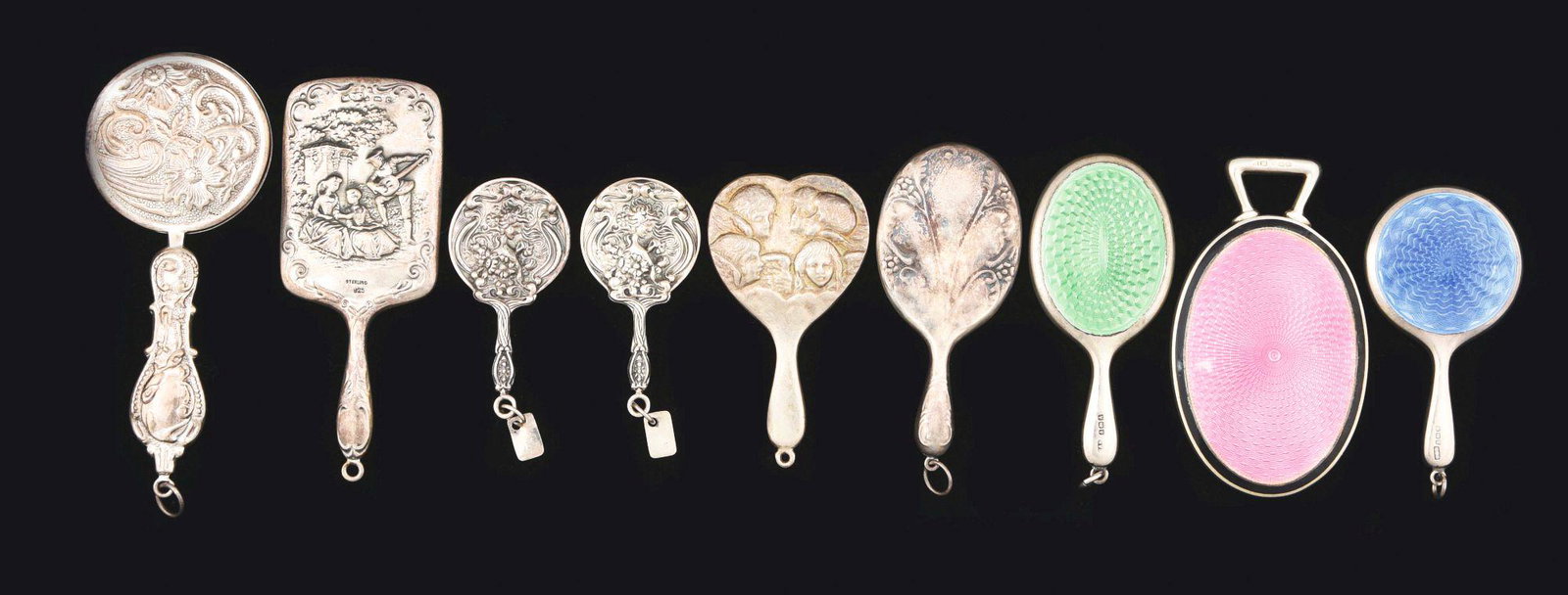 LOT OF STERLING SILVER ANTIQUE MINIATURE MIRRORS.: Lot of antique sterling silver miniature mirrors includes: first, with a man playing mandolin embossed with ladies in garden, 3 - 1/2" long; second, a round handled mirror with embossed floral design,