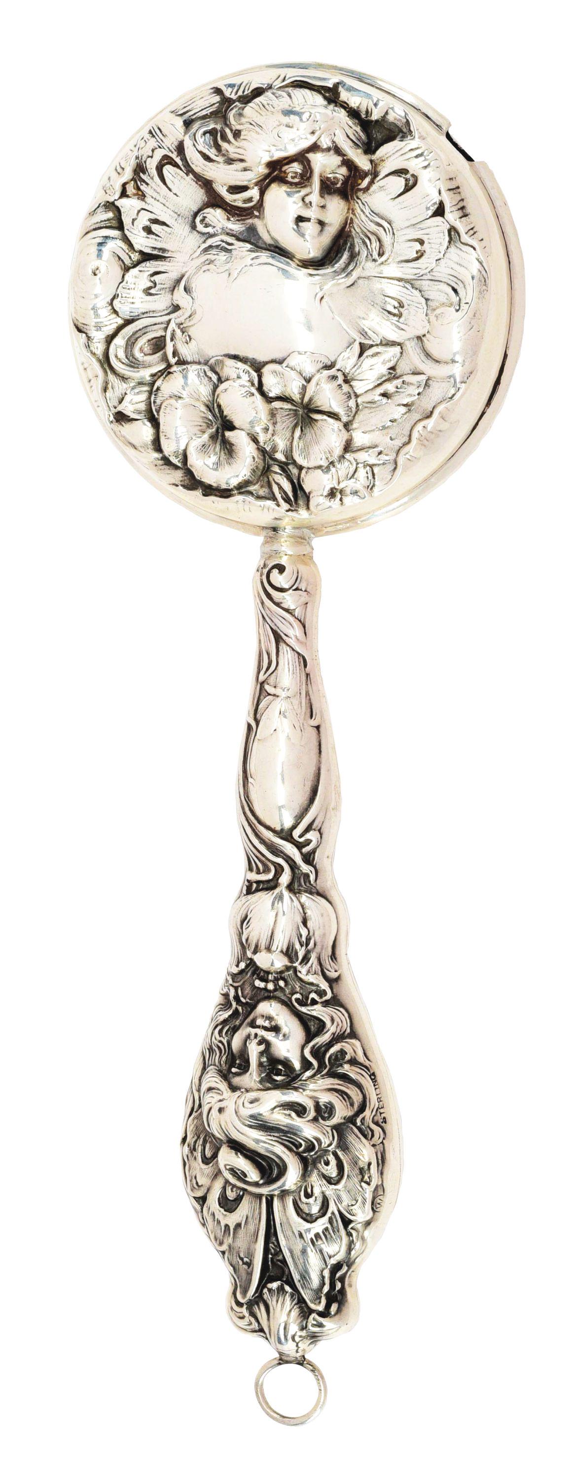 VICTORIAN STERLING SILVER BABY RATTLE ART NOVEAU WITH: Victorian sterling silver baby rattle Art Nouveau with ladies on both sides of handle and both sides of drum. 6 - 1/4". No damage or repairs. Condition: (Excellent). Dimensions: 6 - 1/4" X 2" X 1".