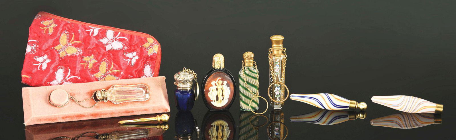 LOT OF 7: ANTIQUE SCENT OR PERFUME BOTTLES.: Lot of seven antique scent or perfume bottles, includes: first, a 19th century French glass bottle with hallmarked sterling top, finger ring and chain, fitted pull and glass stopper, 2" tall; second,
