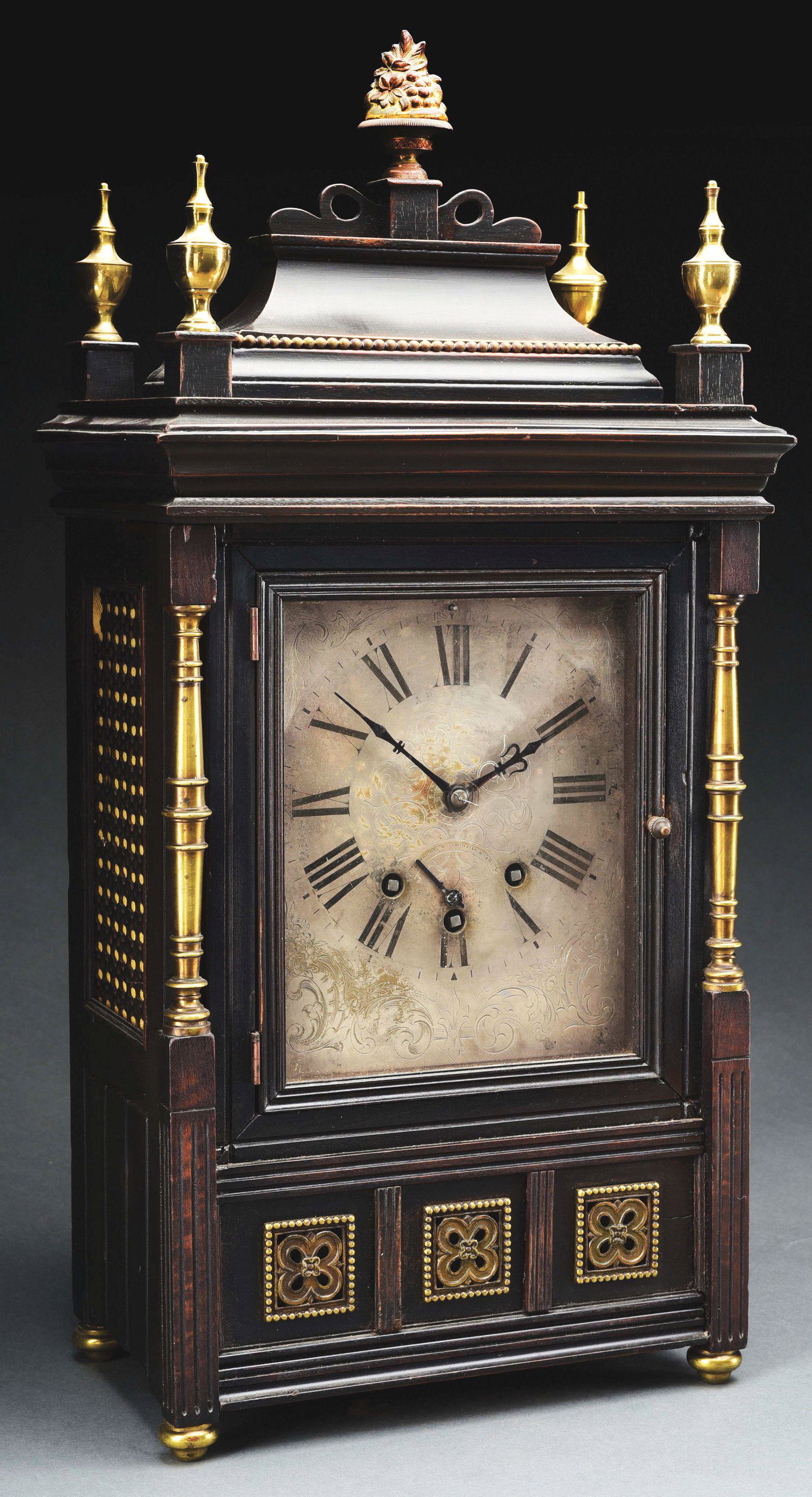 FRENCH MAHOGANY AND BRASS SHELF CLOCK.: French, circa 1890. Mahogany and brass mounts with three train movement marked "AB". Engraved, silvered brass dial. Pierced side panels with small losses. Condition: (Good). Dimensions: 23" x 11" x 6 