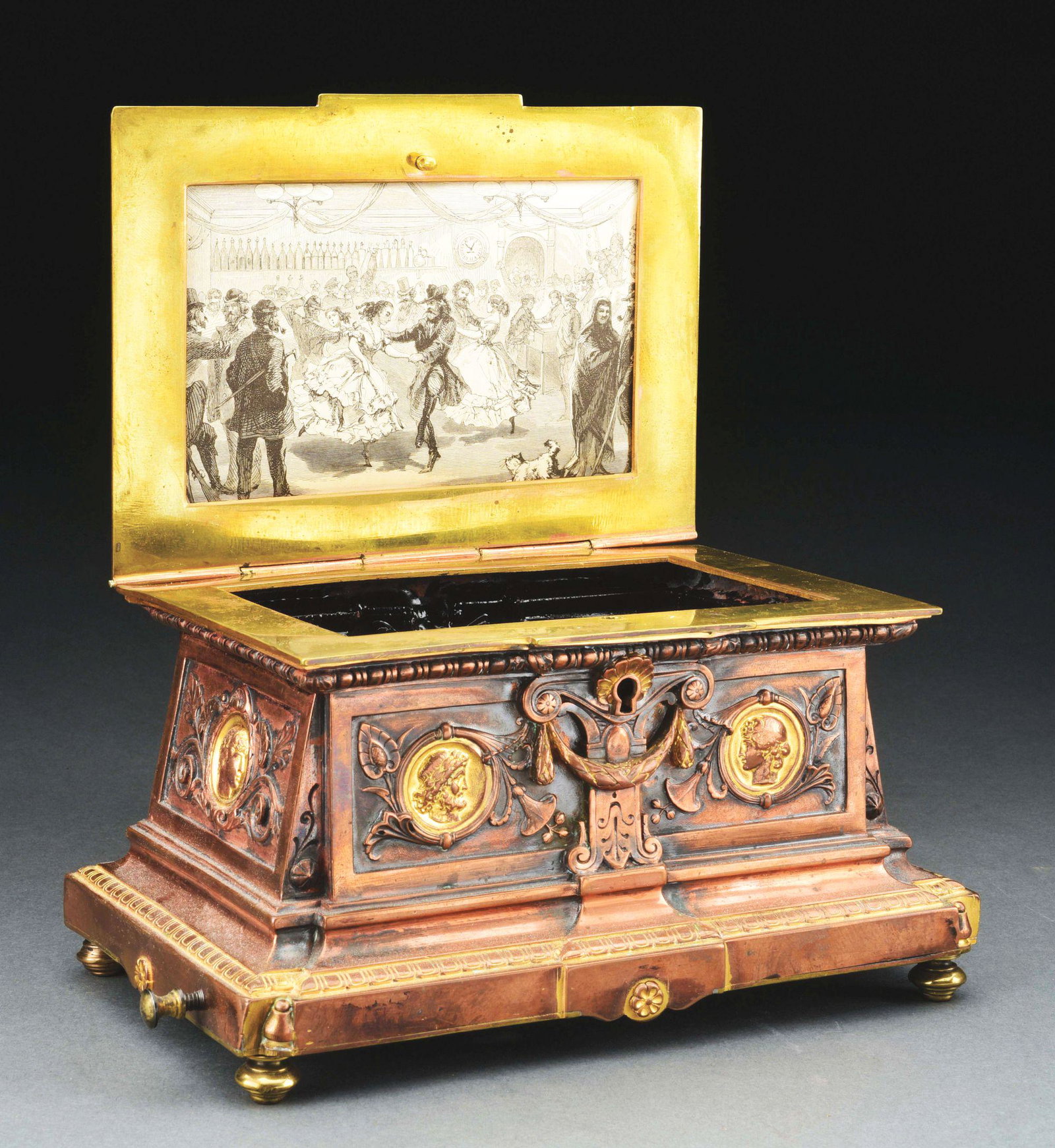 MUSIC BOX.: Brass and pot metal casket with a music box in the bottom. Probably Swiss or French, circa 1880's. Finish worn, missing interior. Morphy's Auctions does not guarantee music boxes to be in working orde