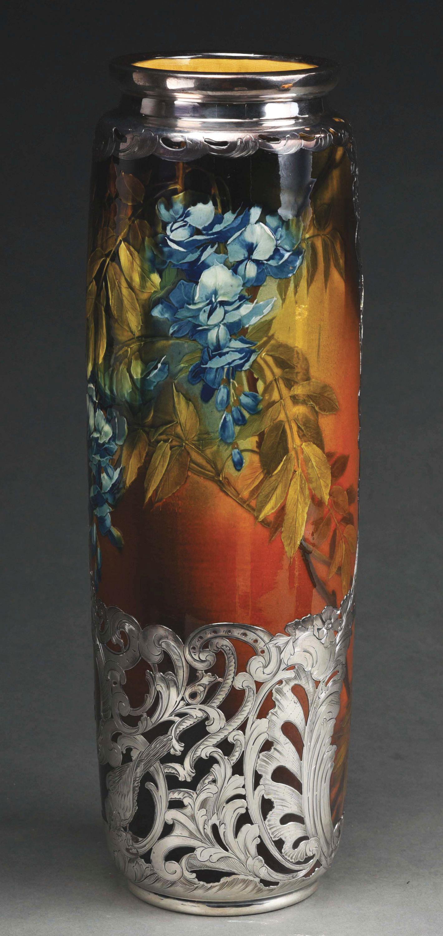MONUMENTAL ROOKWOOD SILVER OVERLAY VASE.: Monumental Rookwood silver overlay vase with brown and green leaves and embossed purple flowers. Heavy sterling overlay with birds and flowers. An amazing piece of artwork pottery by artist Albert Rob