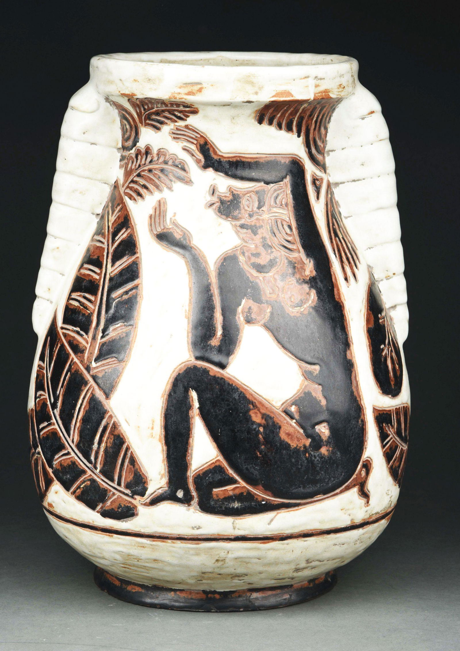 RENE BUTHAUD AFRICAN STYLE POTTERY VASE.: A large and impressive pottery vase by Buthaud. The vase features two nude African figures and oversized leaves in dark brown and black set against an off-white ground. Vase with a pair of handles. St