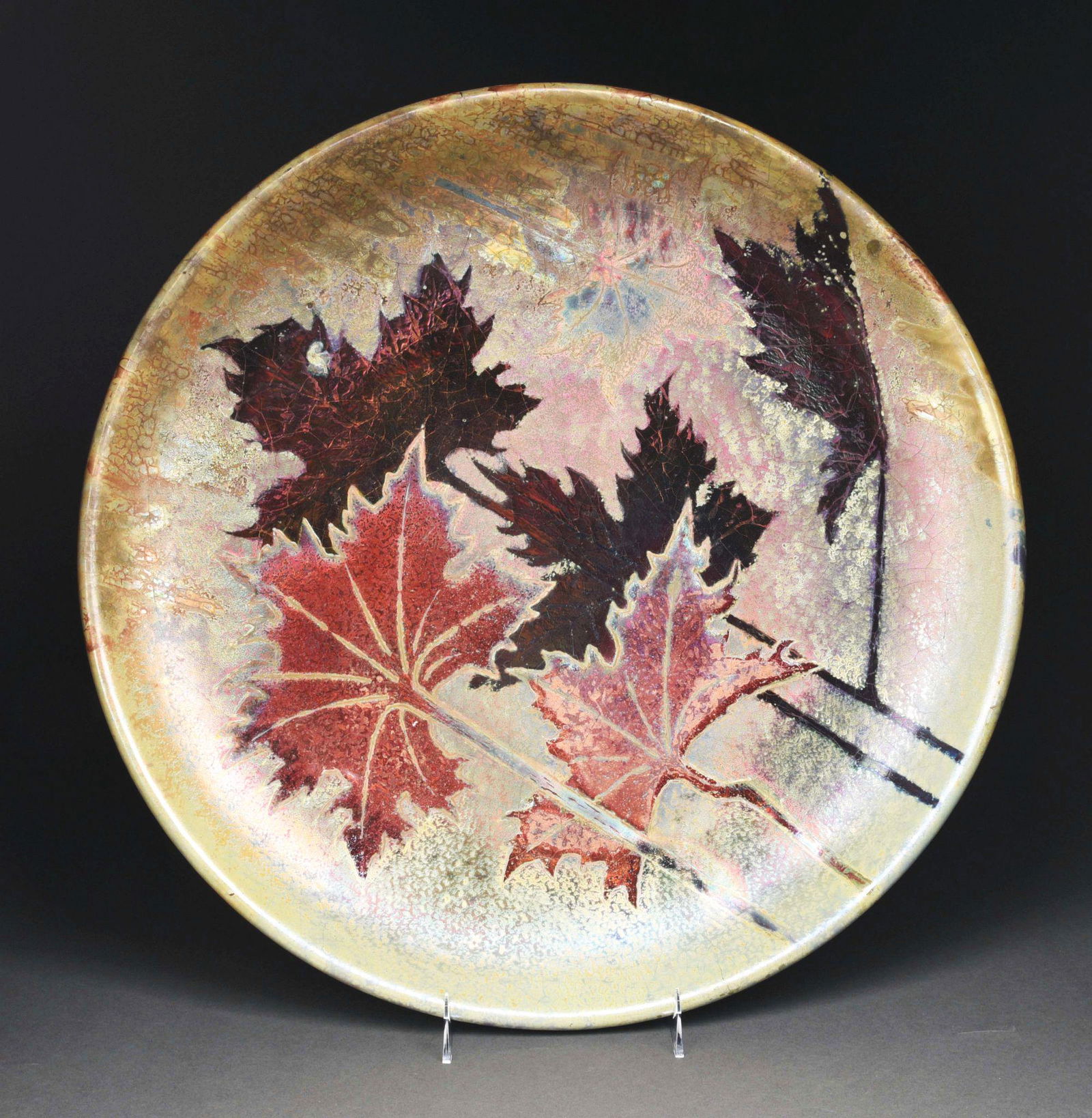 LARGE CHARGER BY CLEMENT MASSIER.: Born into a family of ceramists, Cle´ment Massier took an interest in the business from an early age. In 1883, Massier moved his operations to Golfe-Juan where he began developing his own luster glaz