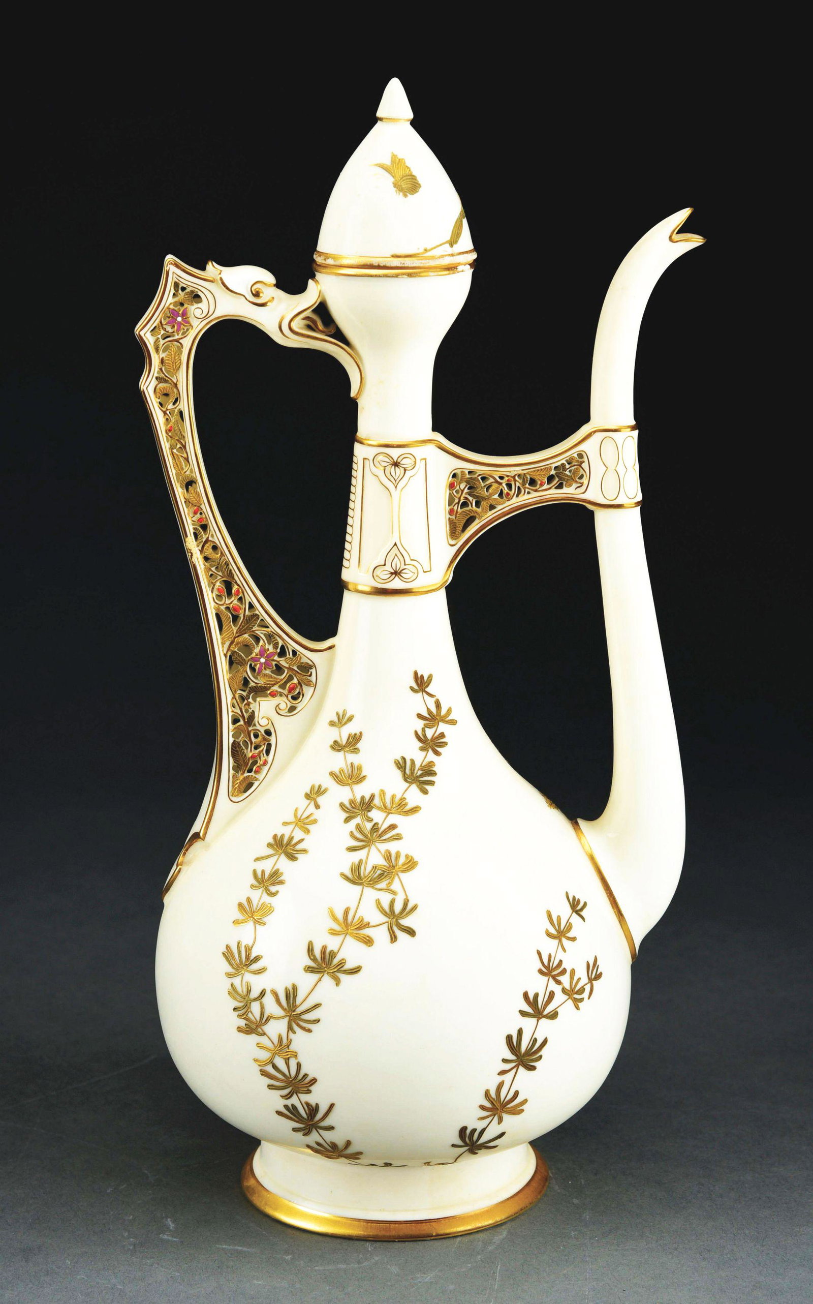 ROYAL WORCESTER AESTHETIC MOVEMENT PITCHER WITH LID.: A beautiful pitcher by Royal Worcester. The pitcher has an off-white background decorated with gold flowers. The conical lid depicts a gold butterfly. The handle has a dragon form and is further decor