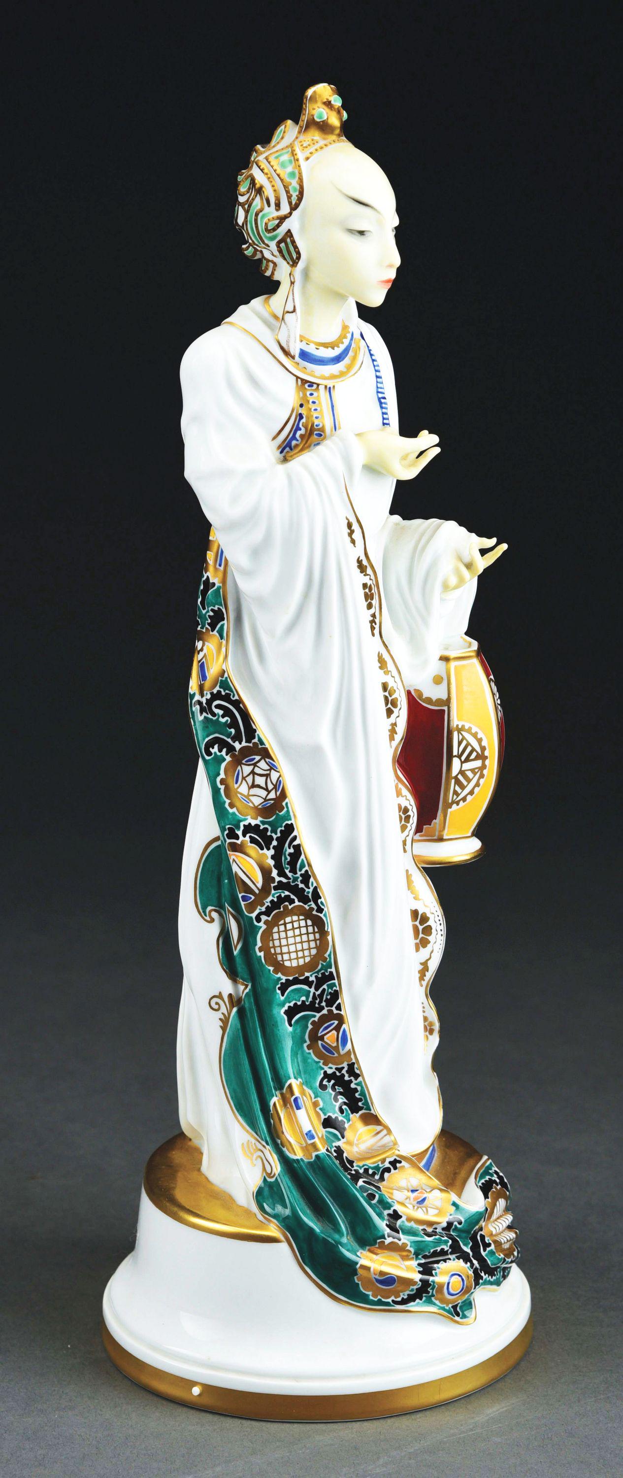 ROSENTHAL RARE PORCELAIN “LANTERN DANCER”.: Designed by Constantin Holzer-Defanti (1881-1951), stylized art deco figure of Asian woman holding a lantern, gilt accents. Marked, C. Holzer-Defanti, impressed H 534, c.1920, Germany. 13 1/2” T. Co