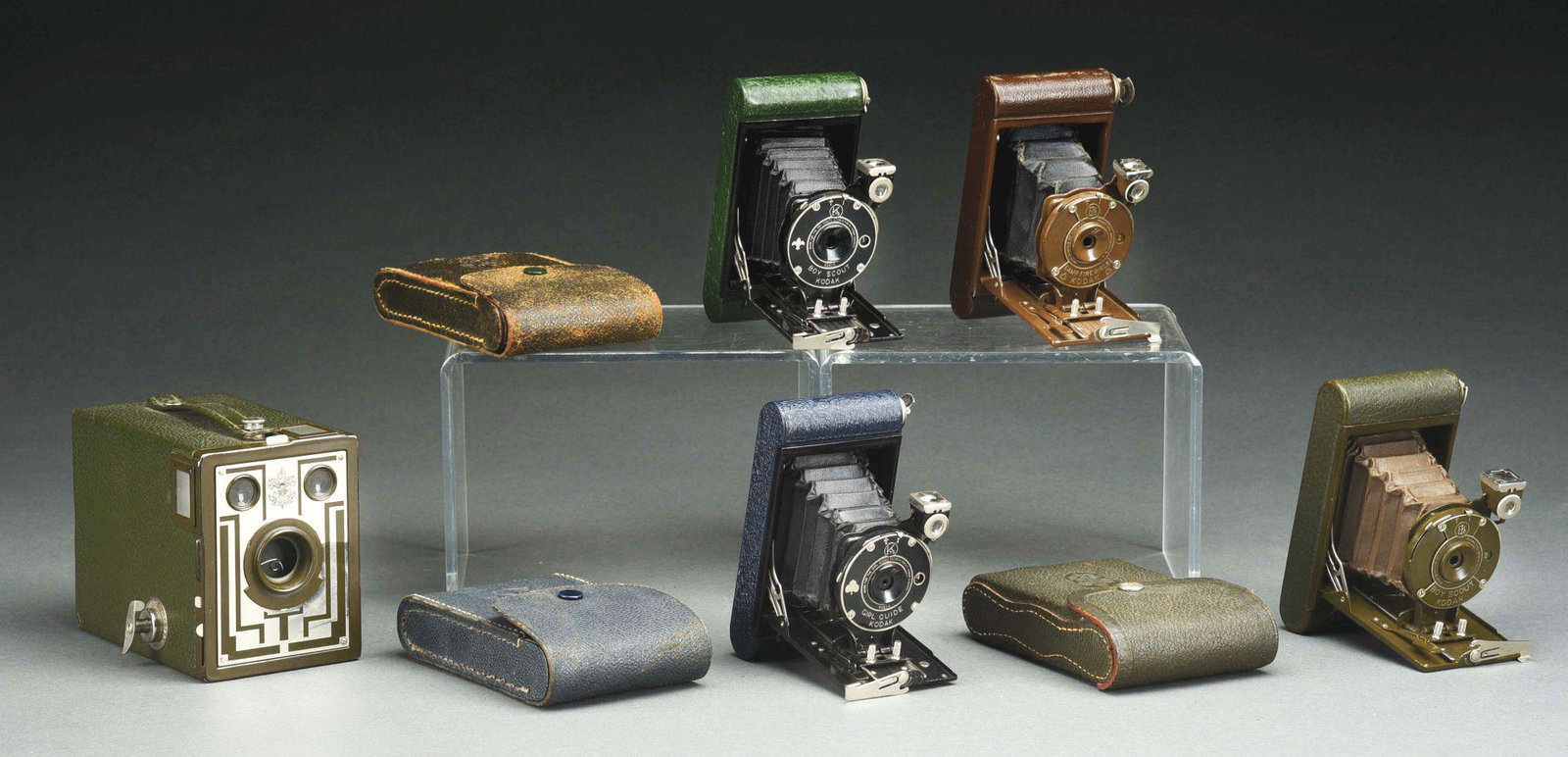 COLLECTION OF FIVE KODAK SCOUTING CAMERAS CIRCA 1929 -: Camp Fire Girls Kodak Vest Pocket Camera. Working shutter, small holes in bellows, very minimal exterior wear and scuffing. Girl Guide Vest Pocket Kodak with Case.Working shutter, small holes in bello