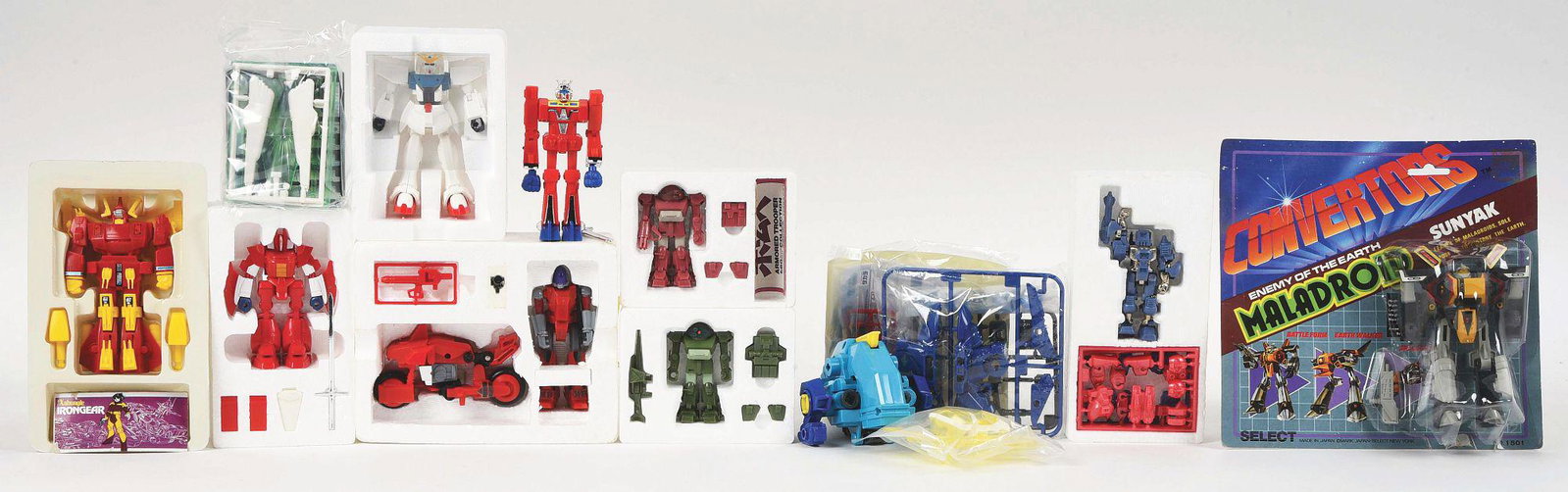 LOT OF 10: VARIOUS JAPANESE PLASTIC AND DIE-CAST TOY: Lot of ten various Japanese plastic and die-cast toy robots. One is a Sunyak Converters Maladroid, on card, but plastic is coming loose. There is a small Scopedog and a Brutishdog, a Bartley motorcycl