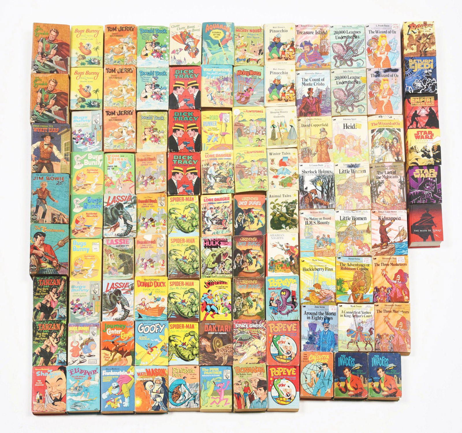 LOT OF APPROXIMATELY 90 VARIOUS MOBY AND WHITMAN BIG: Including some "Star Wars" books, a "Raiders of the Lost Ark" book, a "Wizard of Oz" and many character books, including Spiderman, Popeye, Mickey Mouse, Dick Tracey and others. Condition: (Very Good)