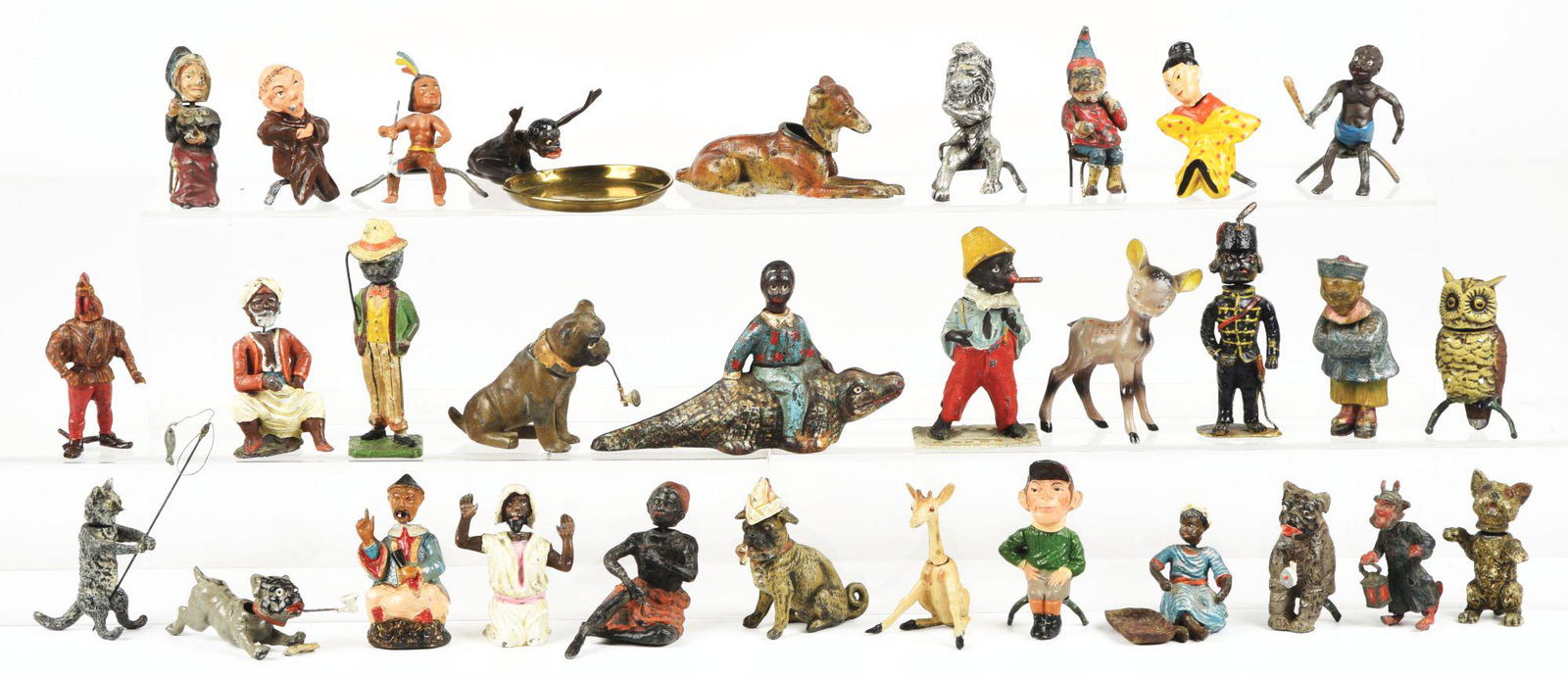 LARGE LOT OF FIGURAL CAST-IRON AND POT METAL FIGURINES. (1 of 1)