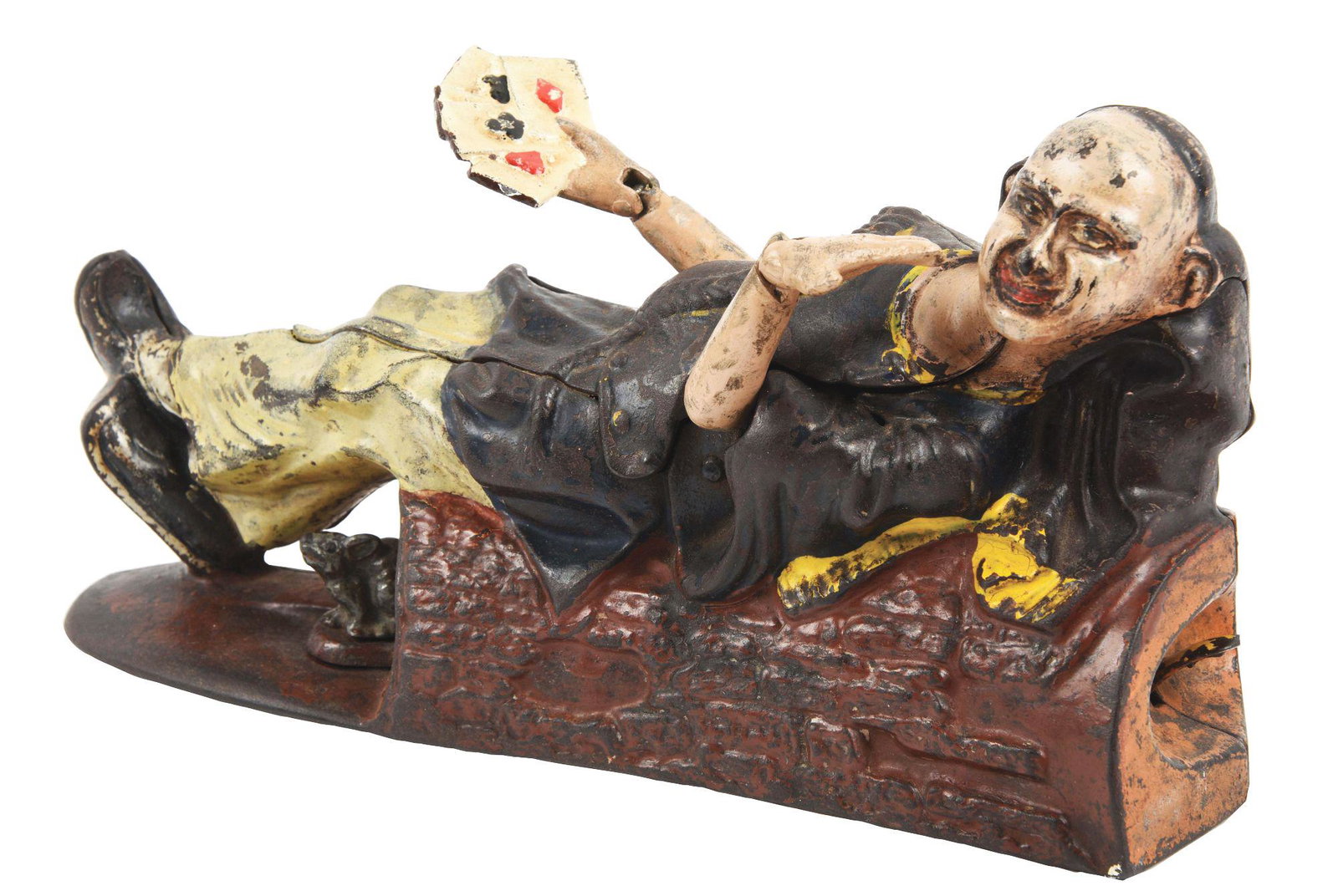 RECLINING CHINAMAN MECHANICAL BANK.: Paint touched up to flesh colors and card hand has been reattached. Condition: (Very Good). Dimensions: 8 - 1/4" X 2 - 3/4" X 4 - 1/2".