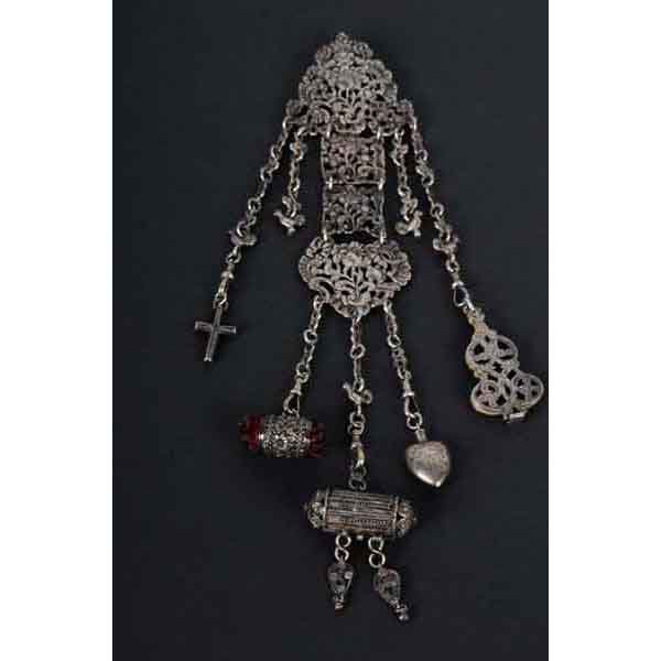 Sterling Silver Chatelaine.: 4.7 troy ounces. Signed W. Thornhill with hallmarks. Five pieces including a cross, writing pad, perfumer, pin cushion, and scent holder. 11" L. (Excellent).
