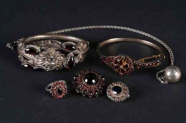 Lot of 6: Jewelry Pieces.: Contains five garnet pieces including two items, two pins, and one ring. Lot also includes one silver baseball necklace dated 1939. (Excellent).