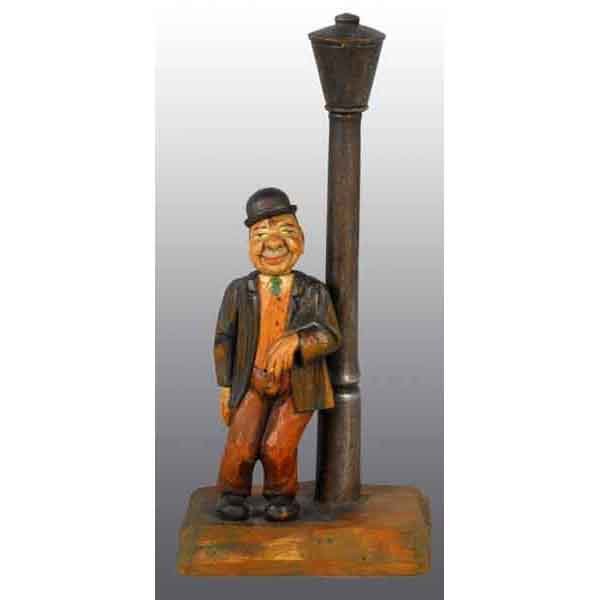 German Carved Wooden Figure of Man.: Man's head removes for a bottle opener and the lamp opens for a corkscrew. 11" T. (Excellent).
