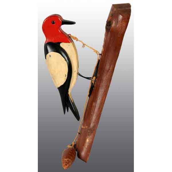 Wooden Folk Art Figural Woodpecker Doorknocker.: Painted wood with twine pull and pine cone shaped handle. From the old Dietrich Farm, Muhlenberg Township, Berks County, PA. 12" L. (Excellent).