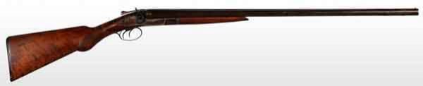 American. L.C. Smith Double Barrel Shotgun.: OL: 46 - 1/4". BL: 30". S: American walnut with rounded pistol grip. Double triggers with a 14 - 7/8" pull. Side lock, double hammer gun with top lever action release. Barrels are marked "Hunter Arms 