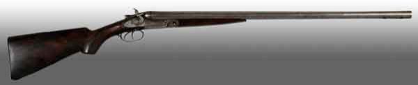 Parker Double Barrel Shotgun.: Patent date January 21, 1883. OL: 46 - 1/2". BL: 30". 12 GA. S: American walnut with conventional pistol grip. Double triggers with 14 - 1/2" pull. Side lock, outside hammer gun with top lever release