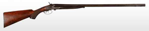 English W.H. Todd Double Barrel Shotgun.: OL: 46 - 1/4". BL: 29 - 3/4". S: English walnut with pistol grip. 12 GA. Double trigger with a pull of 14 - 1/2". Pattern engraving on sideplates of outside locks, trigger guard, and on top and bottom