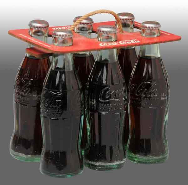 Coca-Cola 6-Pack Carrier with Bottles.: Includes six full Coca-Cola bottles. Minor stain on carrier's rope handle. 7 - 3/4" T. (Excellent).