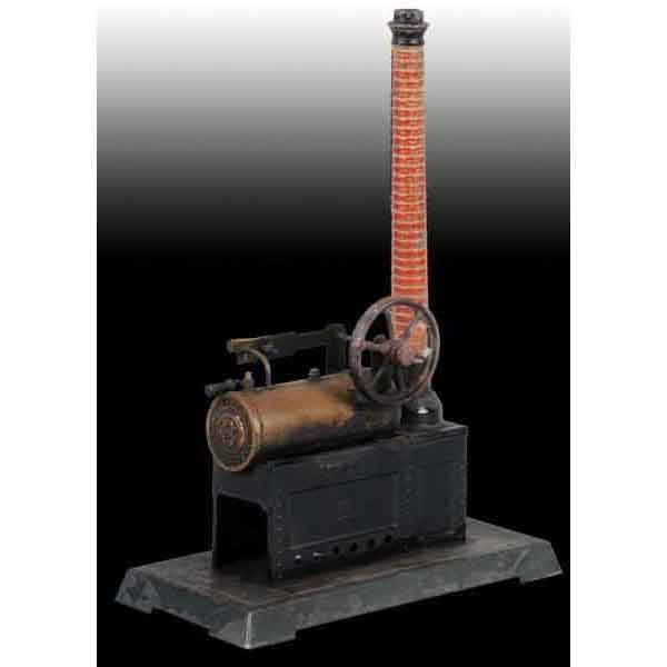 Bing No. 10/129/2 Overtype Steam Engine.: Whistle has lost its top. Some scorching and paint loss. 12 - 1/2" x 6". Base: 9 - 1/2". (Good).