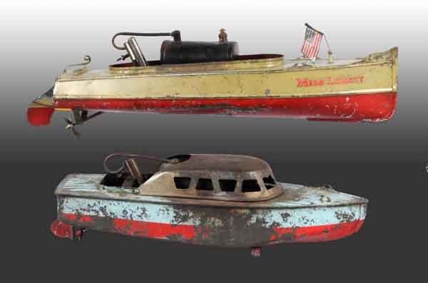 Lot of 2: Steam Boat Toys.: "Miss Liberty" was made by C-K of Japan for the American market. The other steam boat is a cabin curser also made by C-K. Both boats are complete but have substantial paint loss. Largest: 15". (Fair -
