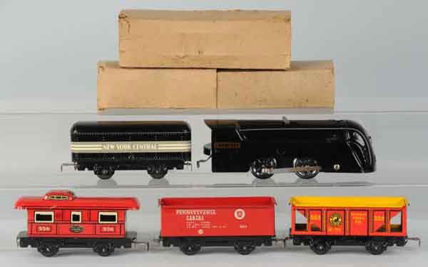 Tin Marx Wind-Up Freight Train Set.: American. Includes steam-type Mercury New York Central engine with matching New York Central tender, no. 554 coal hopper car, no. 73701 Pennsylvania gondola car, and no. 556 New York Central caboose.